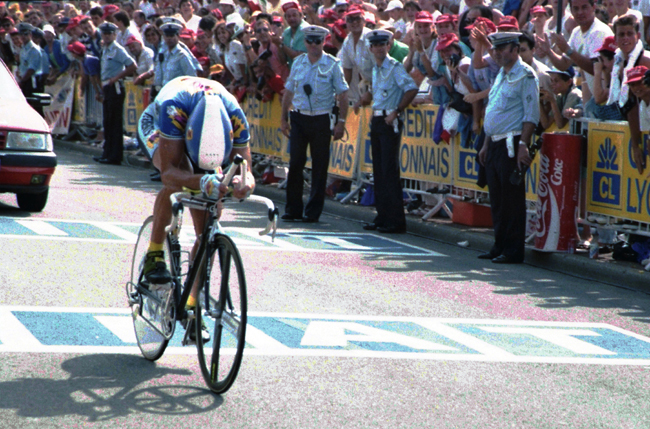 Greg LeMond drives his bike in the stage 21 time trial
